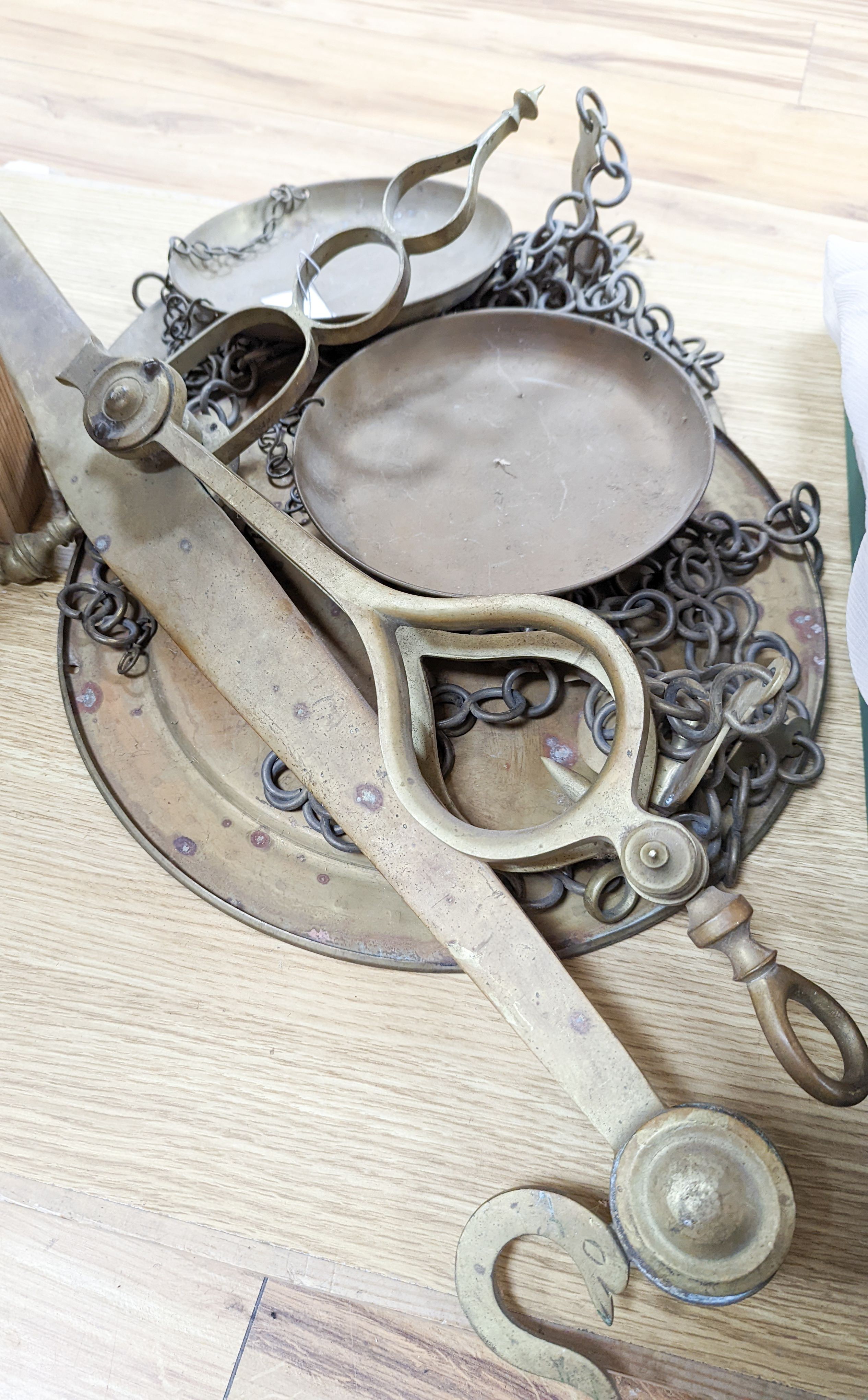A large set of brass hanging scales, 91cm across